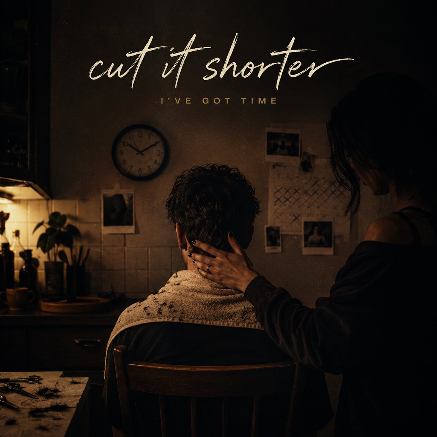 Cut It Shorter cover art: a man on a kitchen chair with a towel round his neck, a woman's hand in his hair, a wall clock behind them.